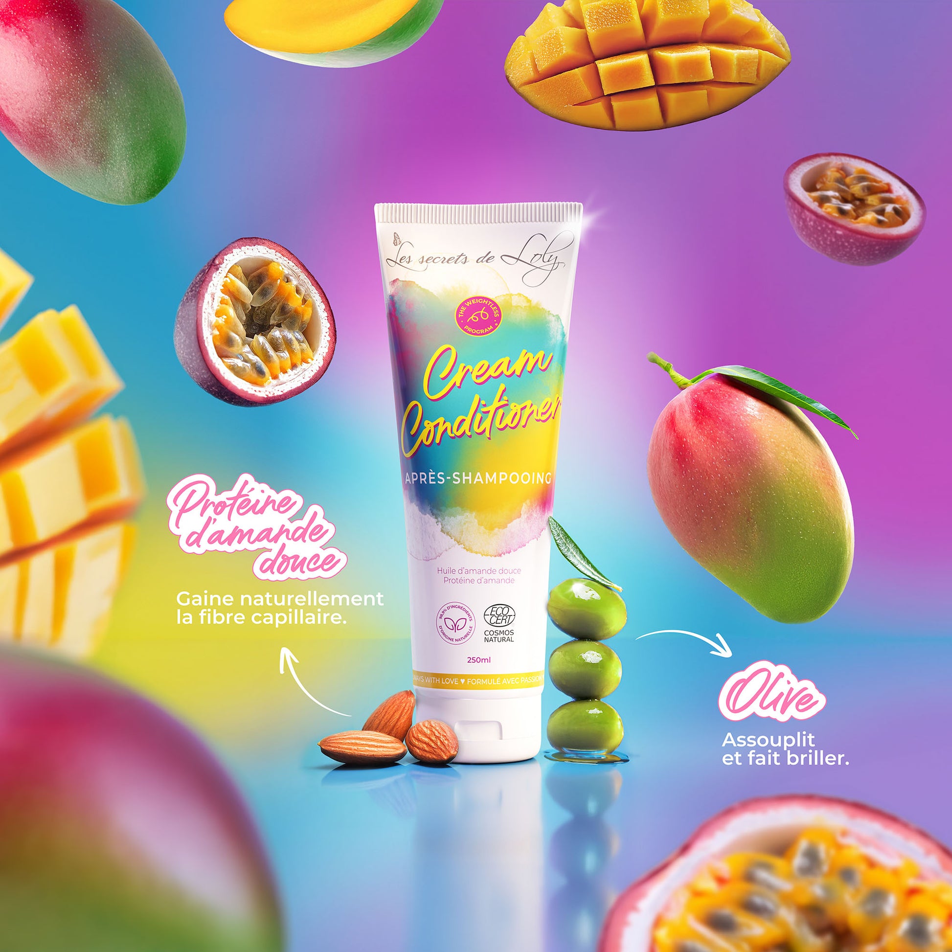 Cream conditioner tube with almonds, olives, mango, and passion fruit on a colorful background, natural hair care.