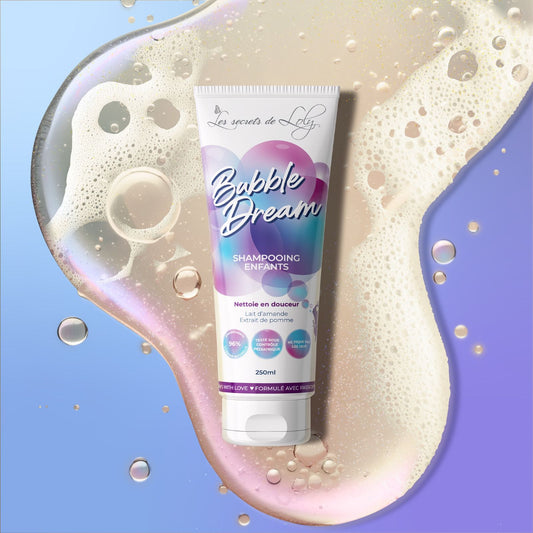 Bubble Dream children’s shampoo with apple extract and almond milk, surrounded by bubbles.