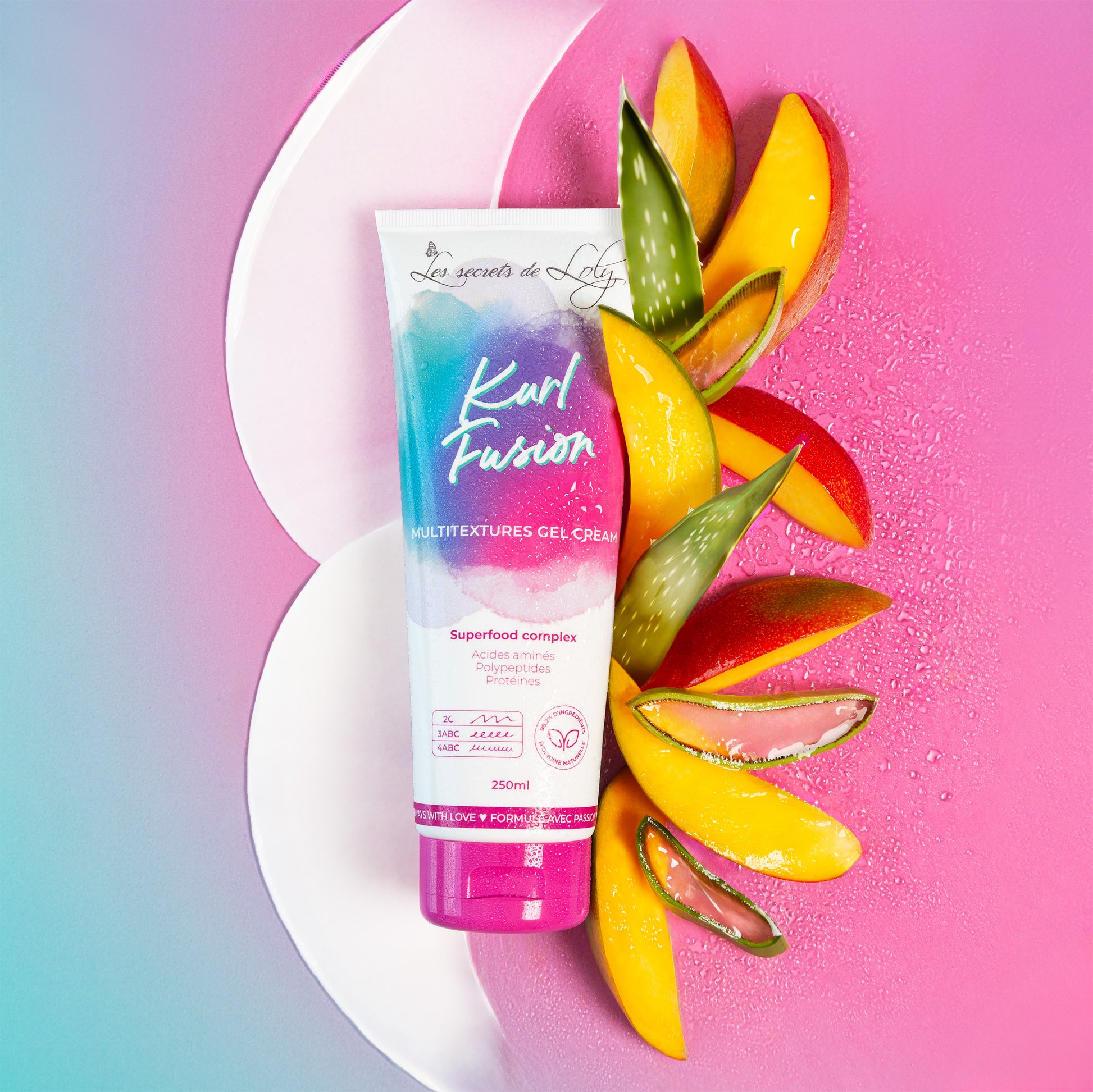 Hair care gel cream tube with aloe vera and mango slices on pink and blue background