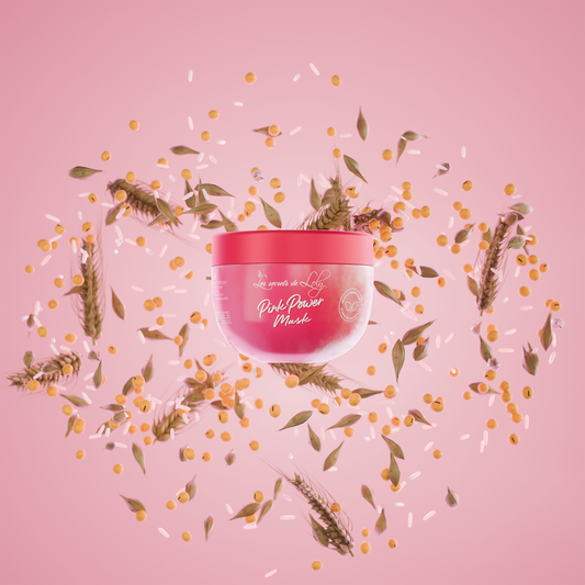 Pink Power hair mask jar with wheat, rice, and plant ingredients on a pink background